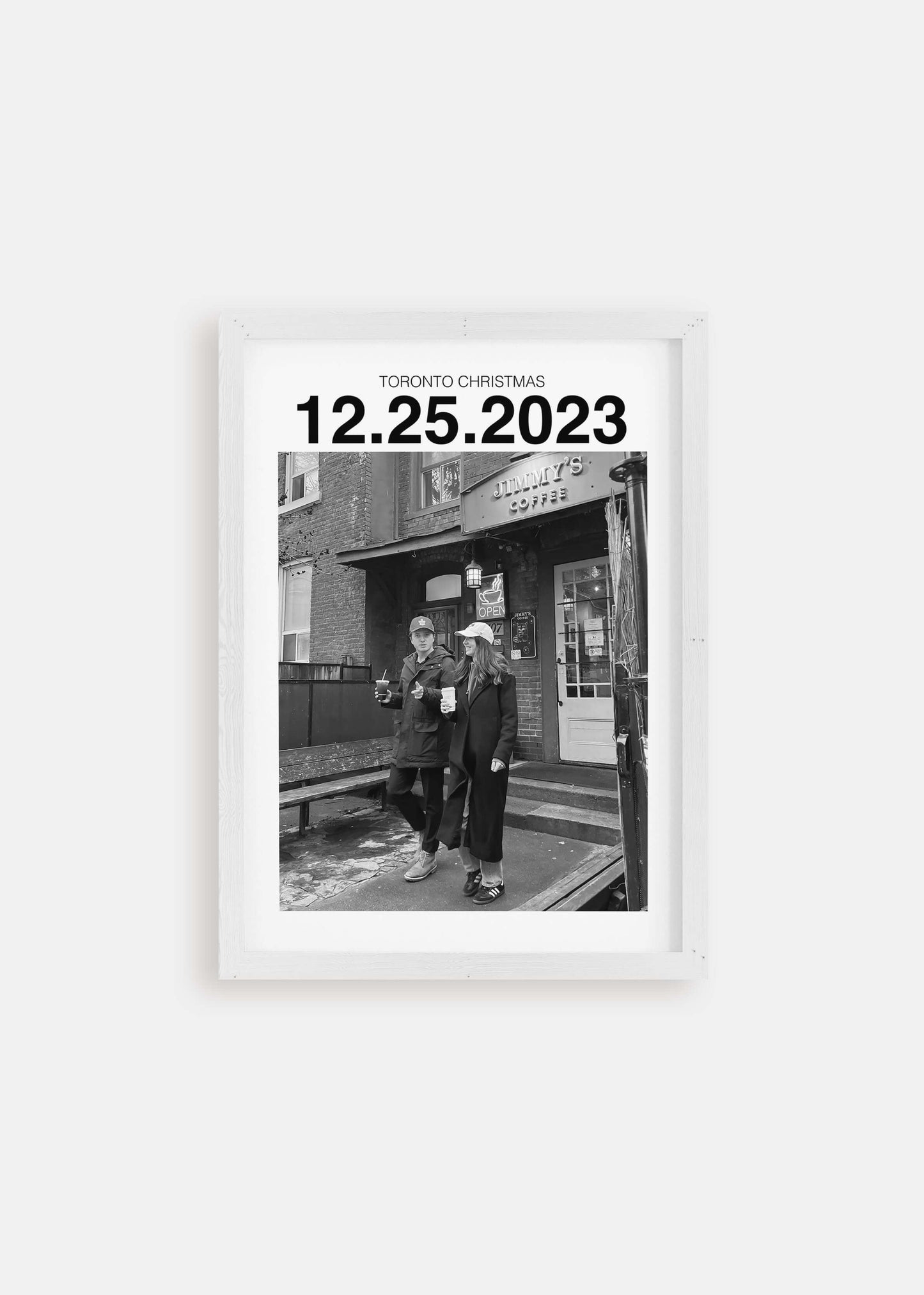 Personalized black and white photo gift with custom date in white frame on white background.