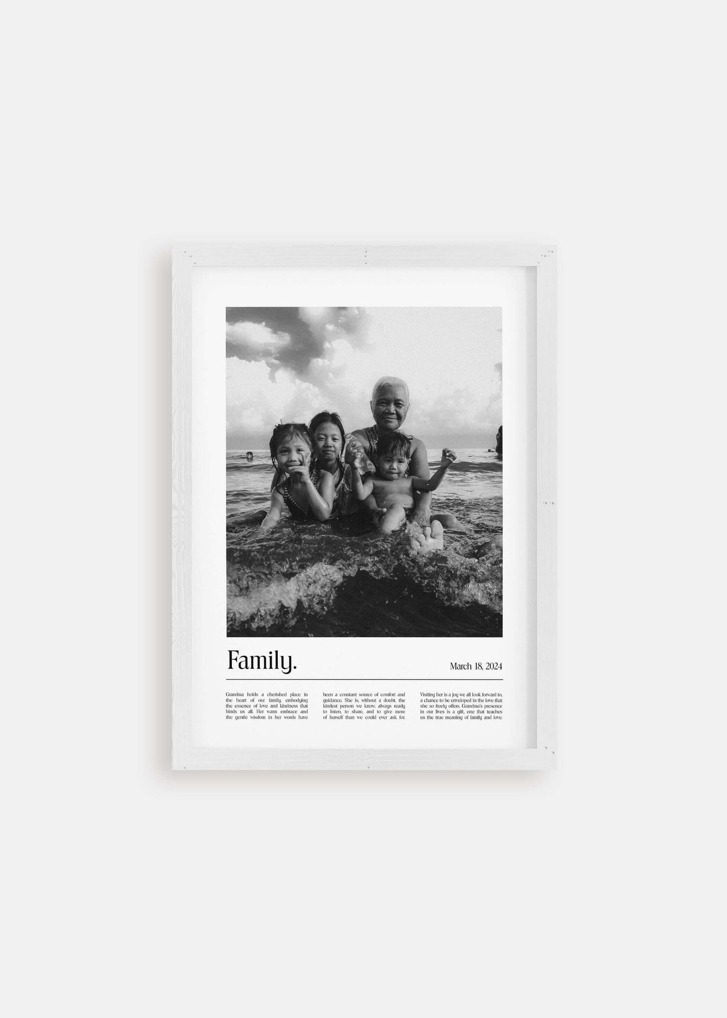 Personalized black and white photo gift of children with grandma and a custom message added. White picture frame on white background.