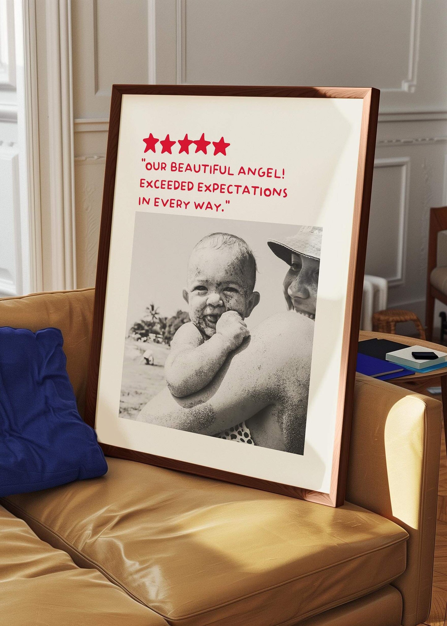 Personalized black and white photo gift in big walnut frame leaning on a sofa. The photo gift is a humorous custom review style design.