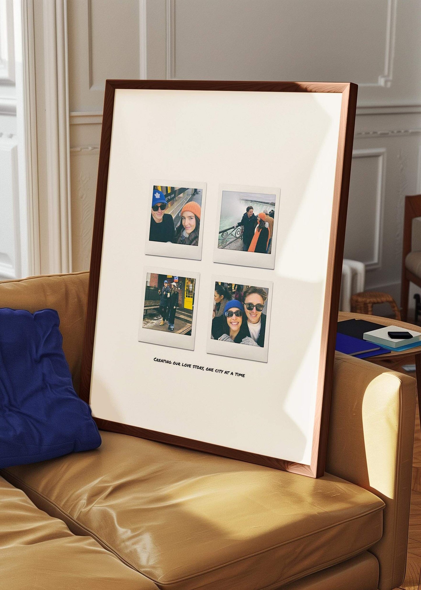 Custom 4 Moments Instant Film Poster framed and resting on a sofa in a contemporary living room, highlighting personal photos in a stylish home setting.