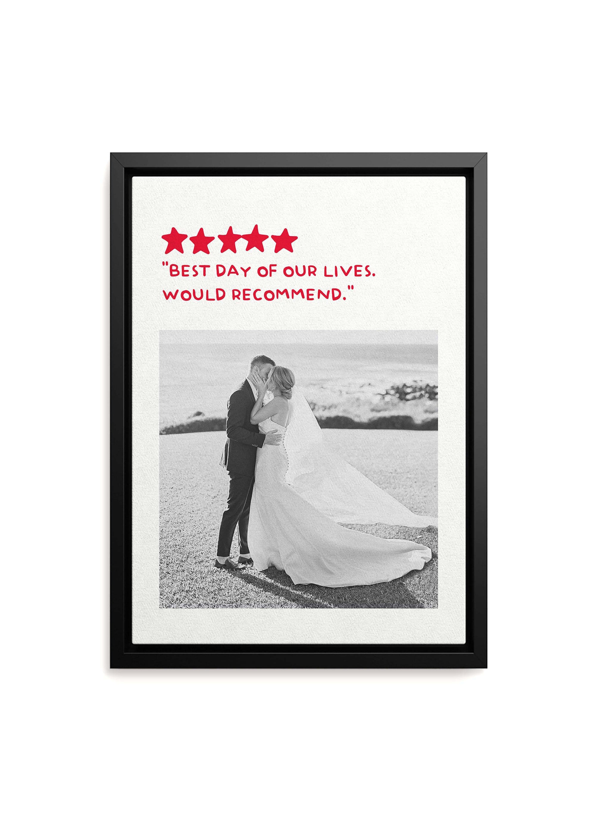 Personalized anniversary gift with photo of couple on their wedding day turned into black and white on black framed canvas with a custom humorous review added. Canvas is on white background.