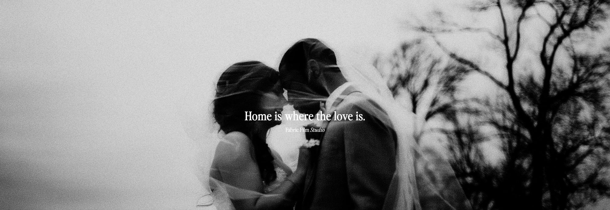 black and white photo art of a couple in warm embrace after their wedding showcasing love and devotion to husband and wife