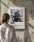 Woman looking at a personalized black and white photo gift on canvas with custom caption on modern raw concrete wall.