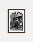 Personalized black and white photo gift with custom date in walnut frame on white background.